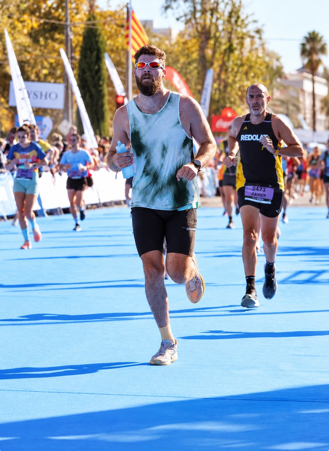 Mikhail running on the road at a local race in Valencia