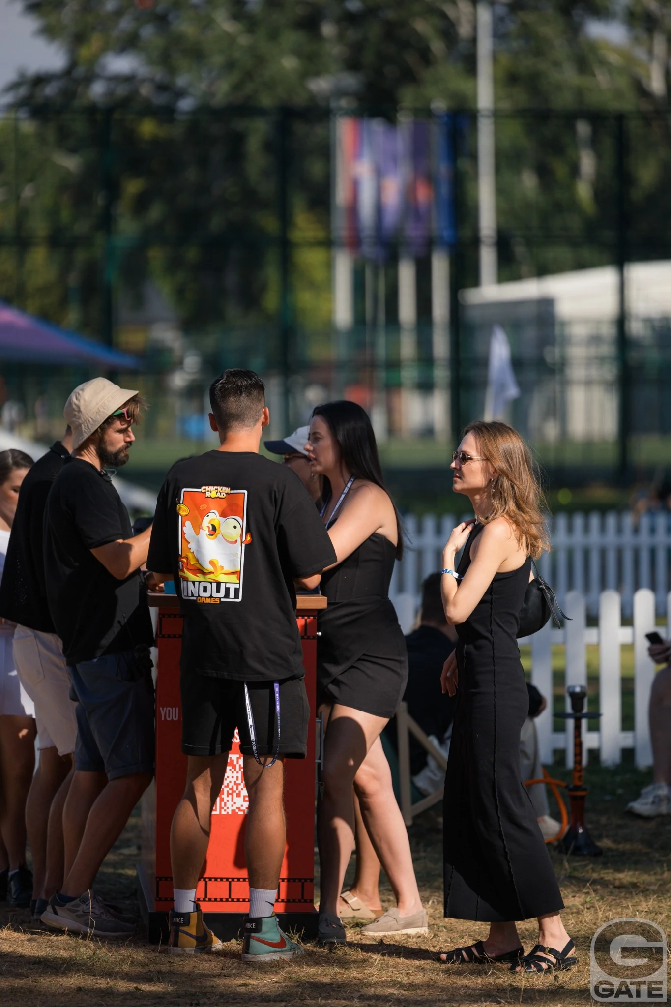 Attendees talking by a partner activation during G GATE CAMP 2024.