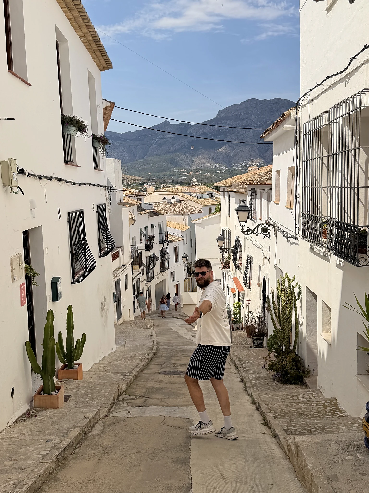 Mikhail Shal in a Mediterranean town surrounded by mountains